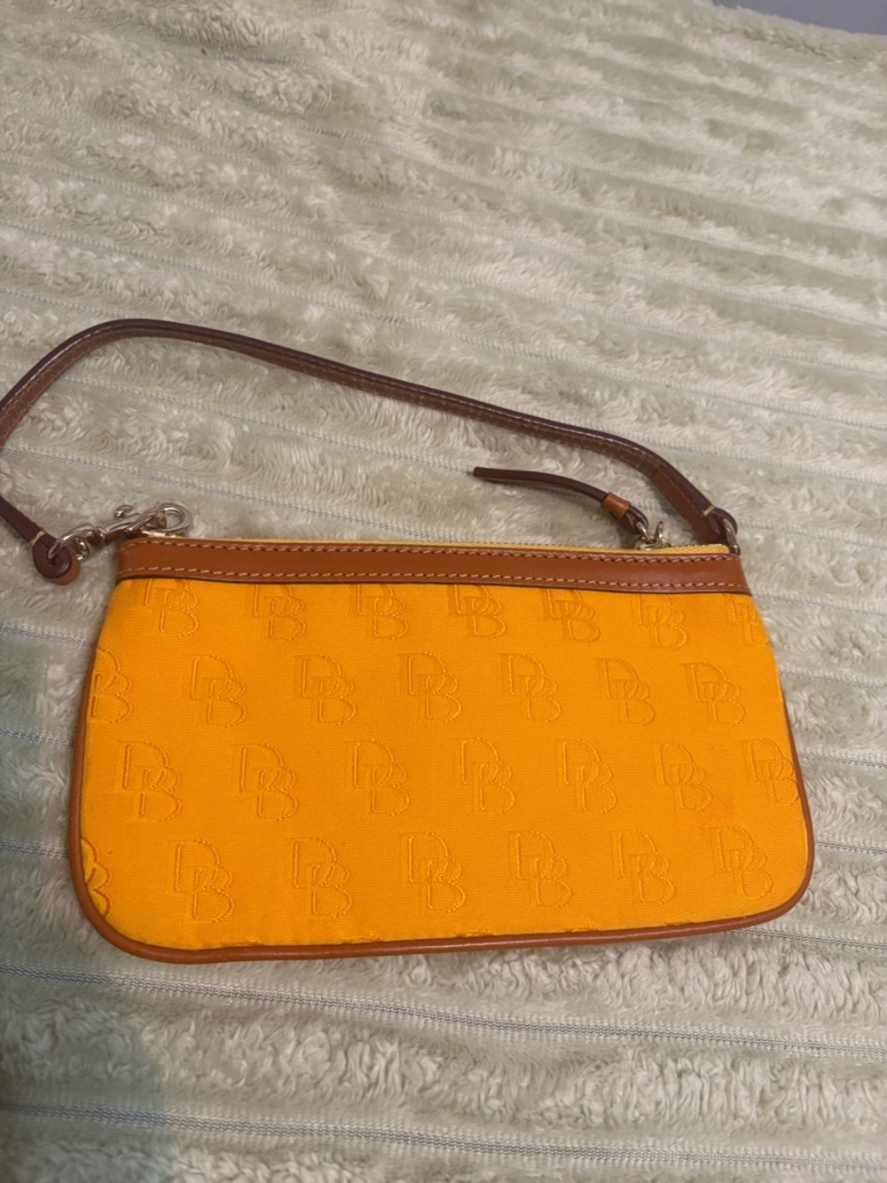 Dooney & Bourke Dandelion Coated cotton/orange Embossed DB Wristlet w/Brown Trim - Picture 2 of 8